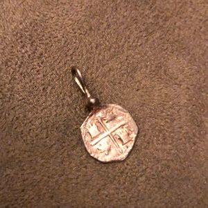 Silver coin charm from island vacation shipwreck